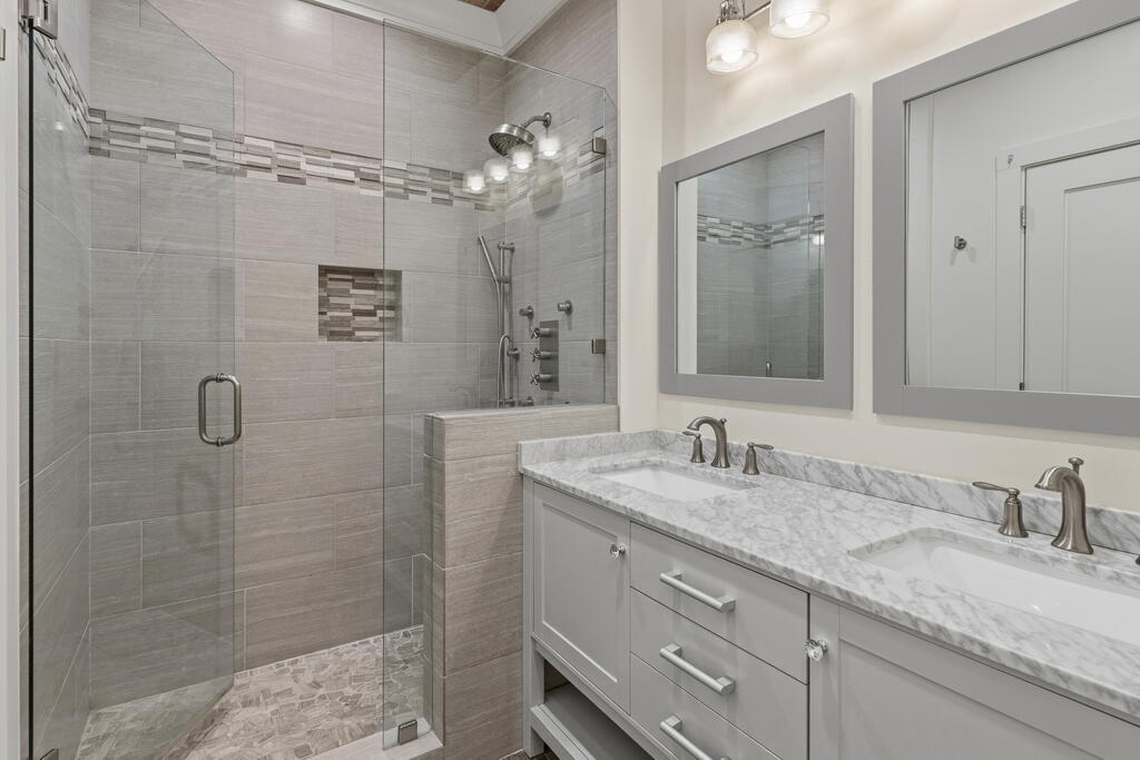 278 Savelle Drive Santa Rosa Beach, FL 32459 - Photo 61 of 157 a bathroom with a granite countertop sink a mirror and shower