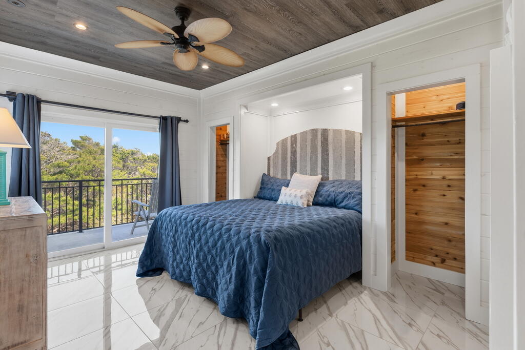278 Savelle Drive Santa Rosa Beach, FL 32459 - Photo 82 of 157 a bed sitting in a spacious bedroom next to a window