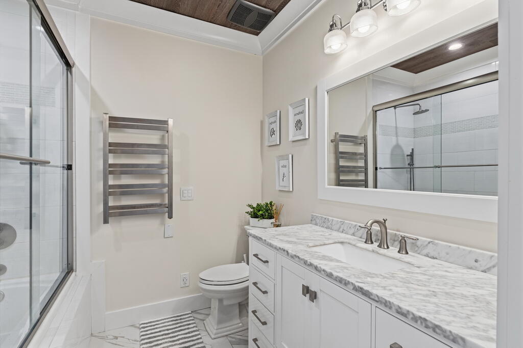 278 Savelle Drive Santa Rosa Beach, FL 32459 - Photo 85 of 157 a bathroom with a granite countertop sink a toilet and a shower