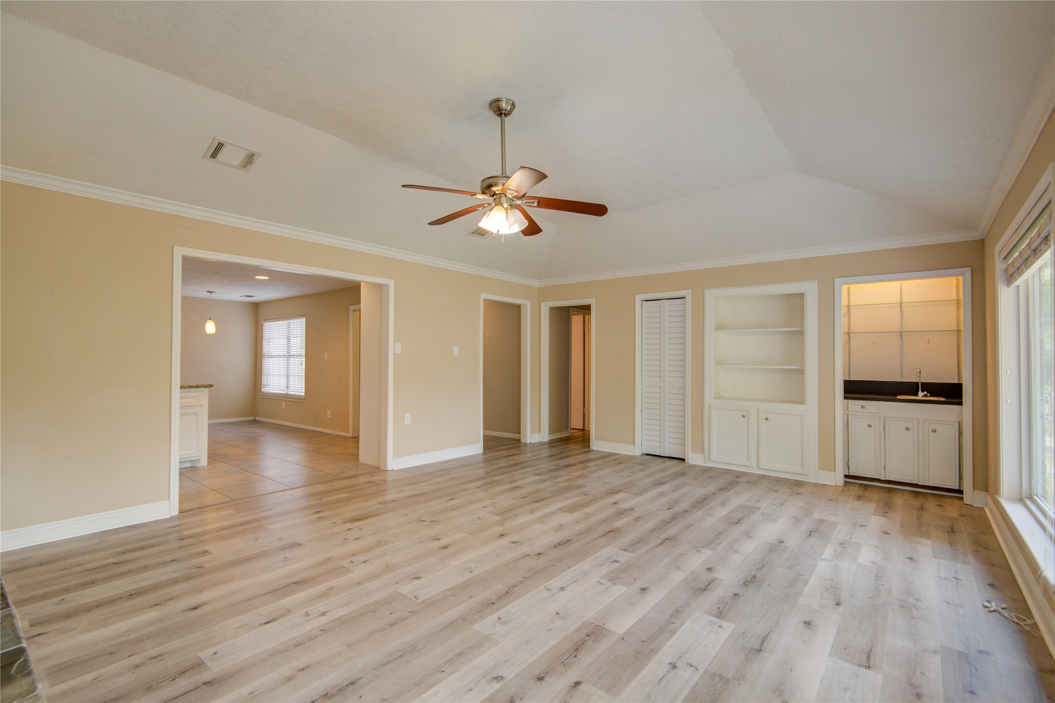 14211 Ella Lee Lane Houston, TX 77077 - Photo 18 of 42 a view of an empty room with window and wooden floor