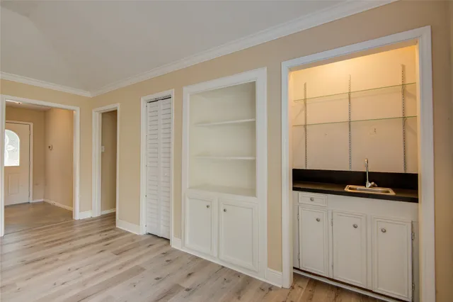 a room with two sink and a window