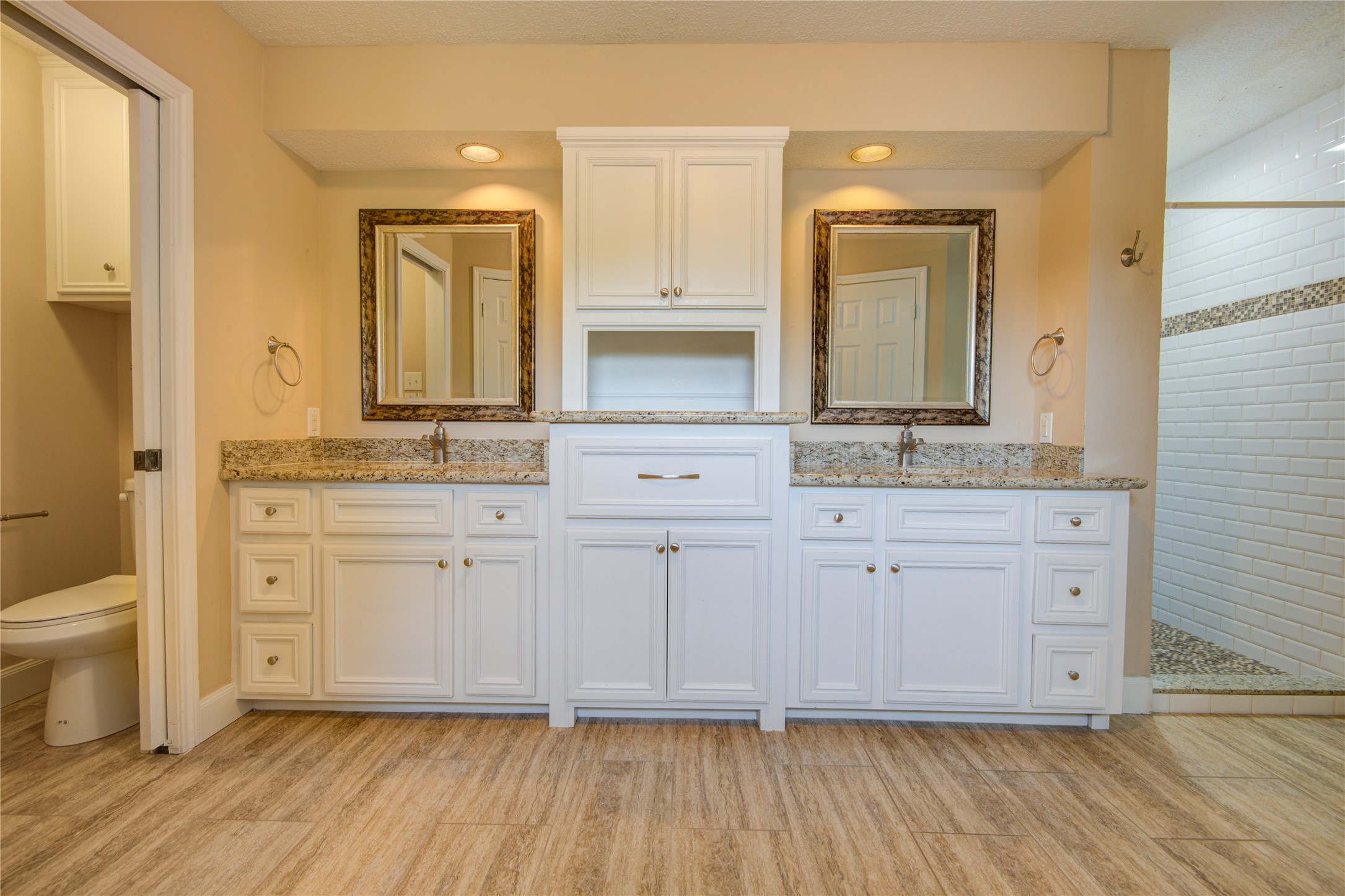 14211 Ella Lee Lane Houston, TX 77077 - Photo 35 of 42 a bathroom with a sink and a mirror