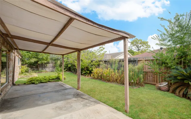 a view of a backyard with plants and garden