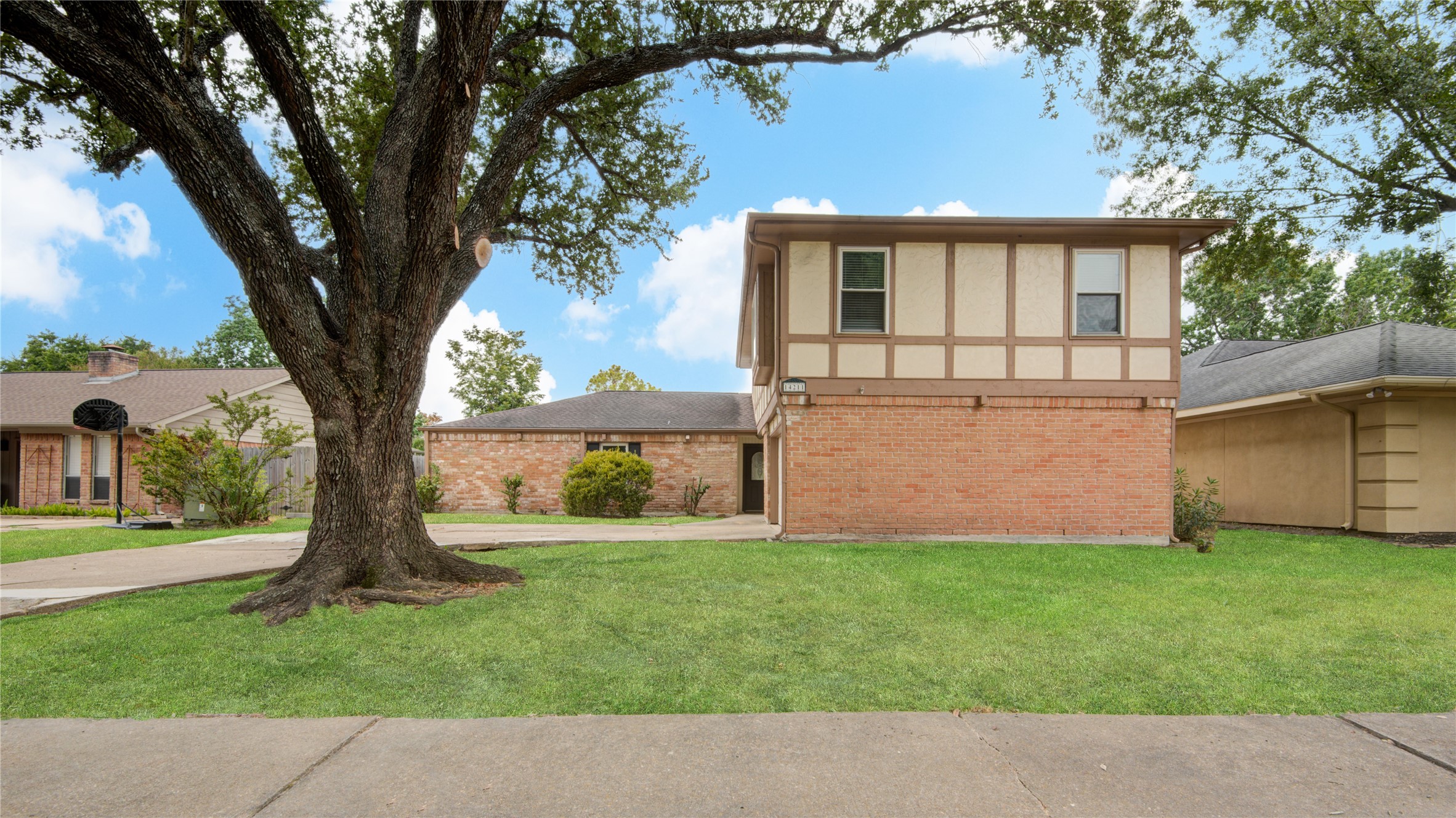 14211 Ella Lee Lane Houston, TX 77077 - Photo 5 of 42 front view of a house with a yard