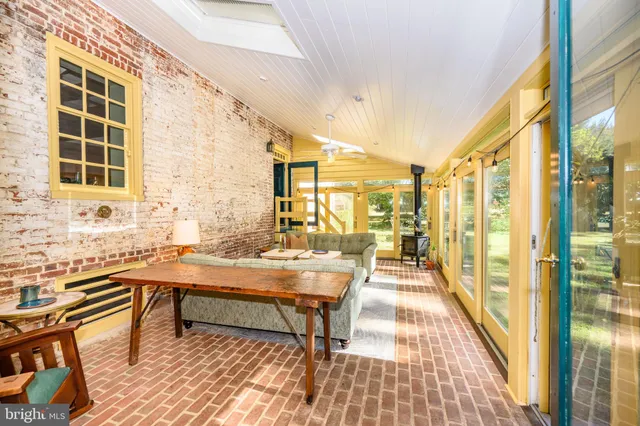 a balcony with chairs and table
