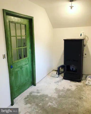 a room with a flat screen tv and a fireplace