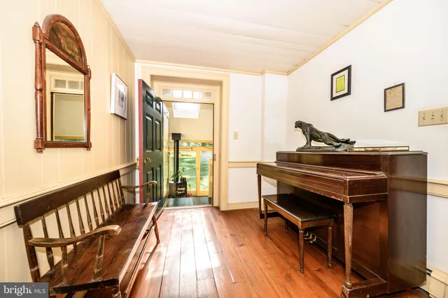 a view of a livingroom with furniture and staircase