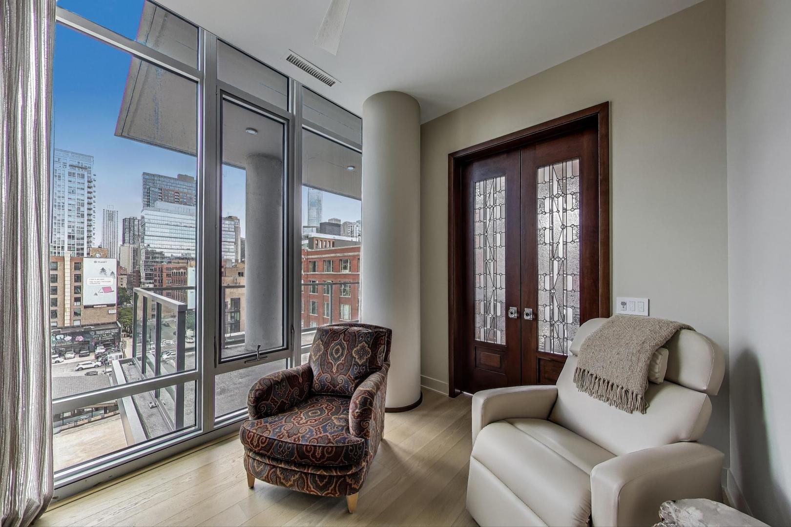 360 West Erie Street, Unit 7D Chicago, IL 60654 - Photo 27 of 39 a living room with furniture and a large window