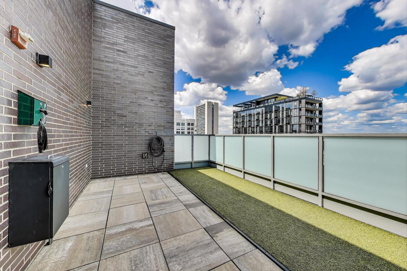 360 West Erie Street, Unit 7D Chicago, IL 60654 - Photo 36 of 39 a view of a terrace with a bench