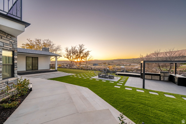 476 Spring Drive Toquerville, UT 84774 - Photo 81 of 95 View of grassy yard with an outdoor kitchen and a patio