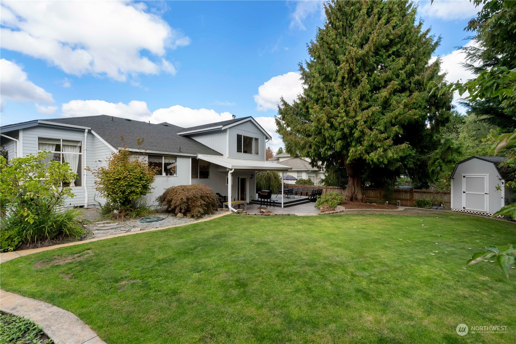 3534 Crystal Ridge Drive Southeast Puyallup, WA 98372 - Photo 11 of 39 a view of a house with a backyard
