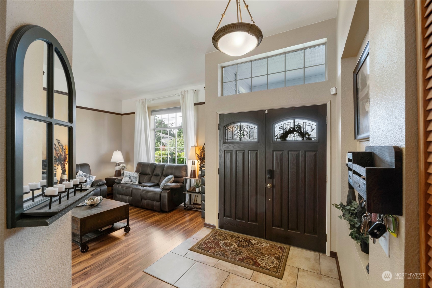 3534 Crystal Ridge Drive Southeast Puyallup, WA 98372 - Photo 13 of 39 a living room with furniture a window and a fireplace