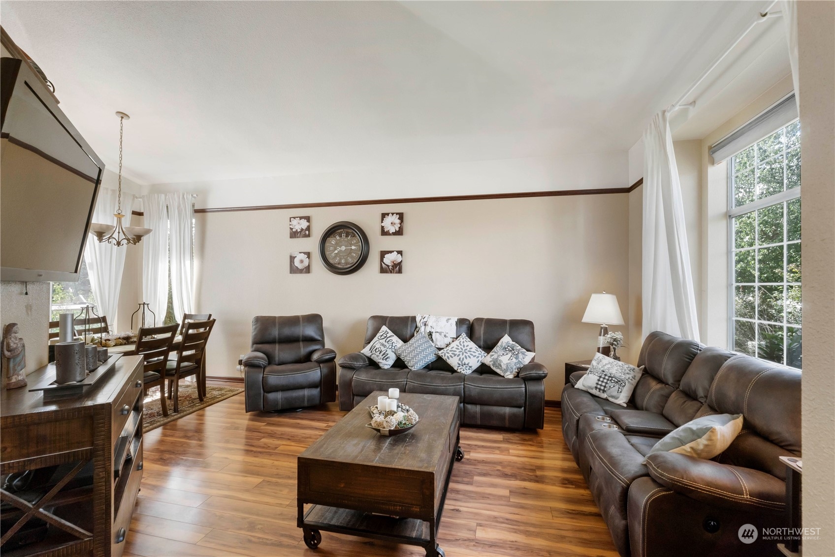 3534 Crystal Ridge Drive Southeast Puyallup, WA 98372 - Photo 15 of 39 a living room with furniture wooden floor and a large window