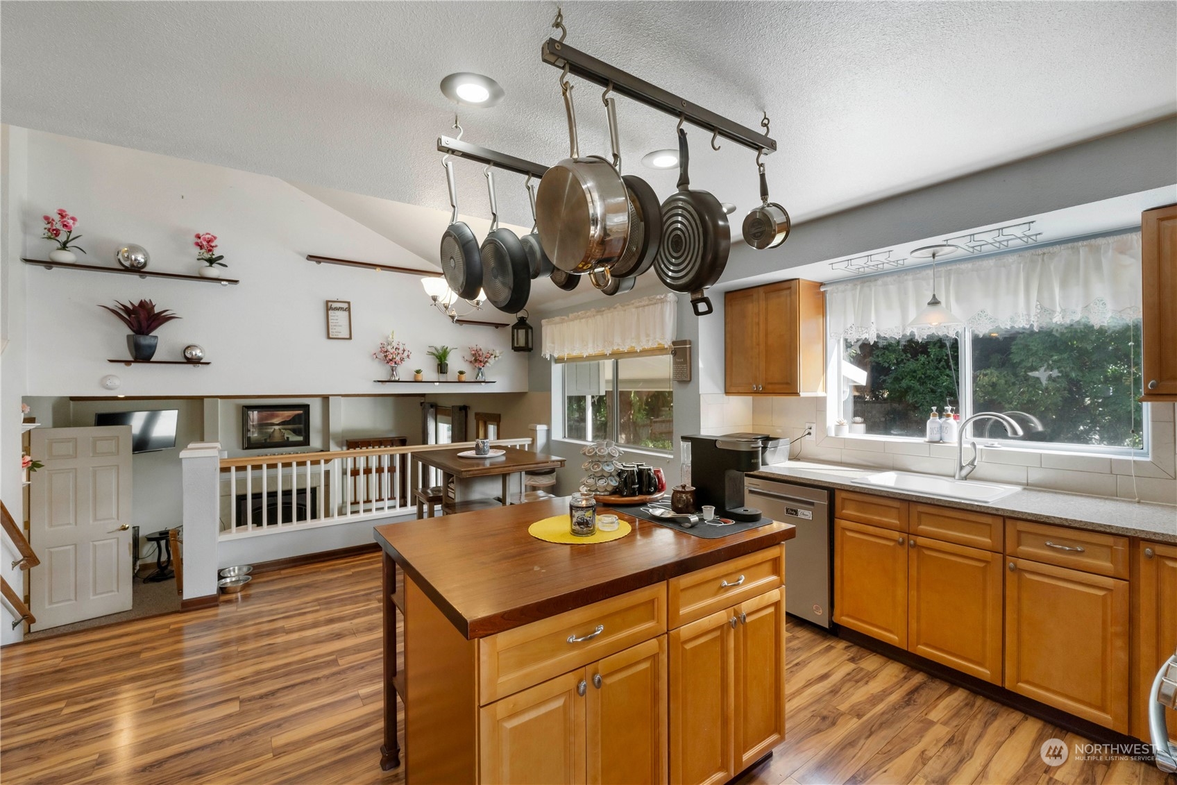 3534 Crystal Ridge Drive Southeast Puyallup, WA 98372 - Photo 17 of 39 a kitchen with a sink cabinets and wooden floor