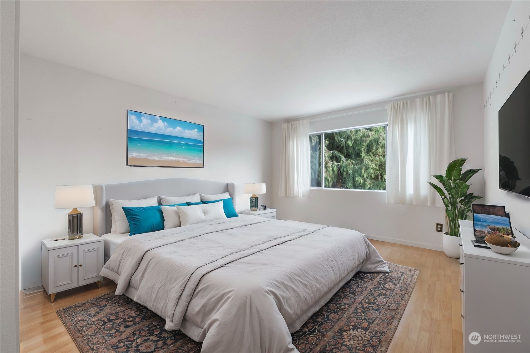 3534 Crystal Ridge Drive Southeast Puyallup, WA 98372 - Photo 2 of 39 a bedroom with a large bed and a potted plant