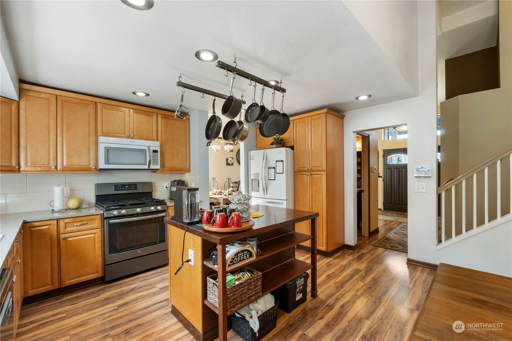 3534 Crystal Ridge Drive Southeast Puyallup, WA 98372 - Photo 24 of 39 a kitchen with granite countertop stainless steel appliances stove top oven and cabinets