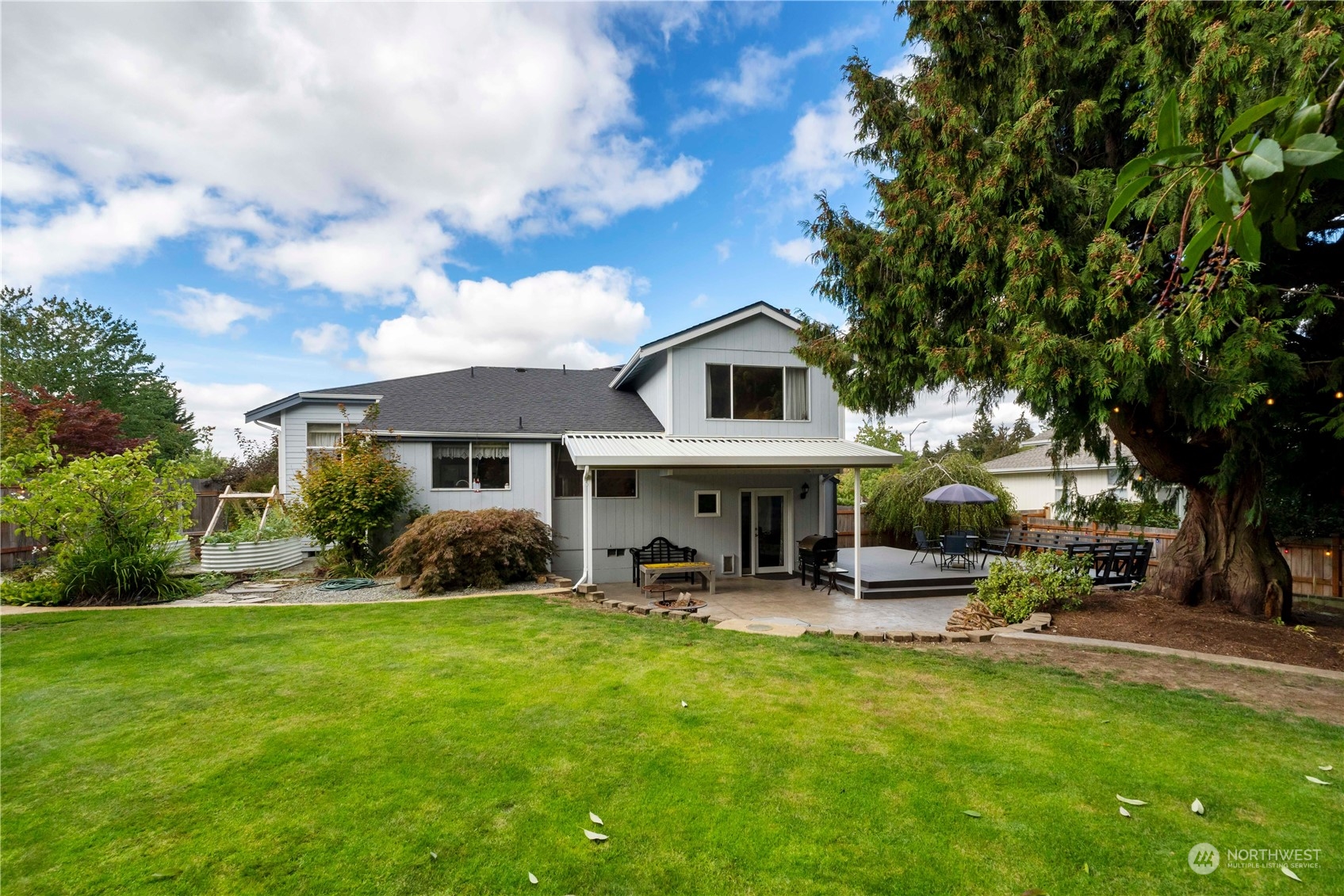 3534 Crystal Ridge Drive Southeast Puyallup, WA 98372 - Photo 30 of 39 a view of a house with a back yard