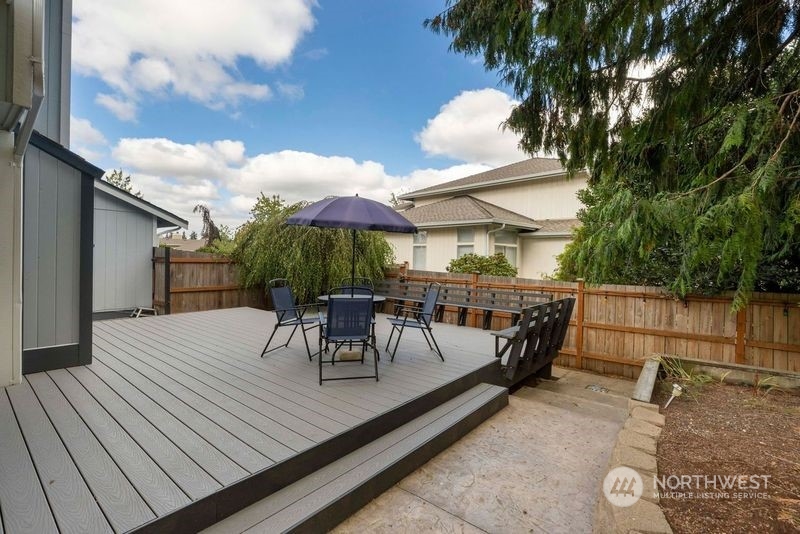 3534 Crystal Ridge Drive Southeast Puyallup, WA 98372 - Photo 33 of 39 a view of house with patio outdoor seating and covered with trees
