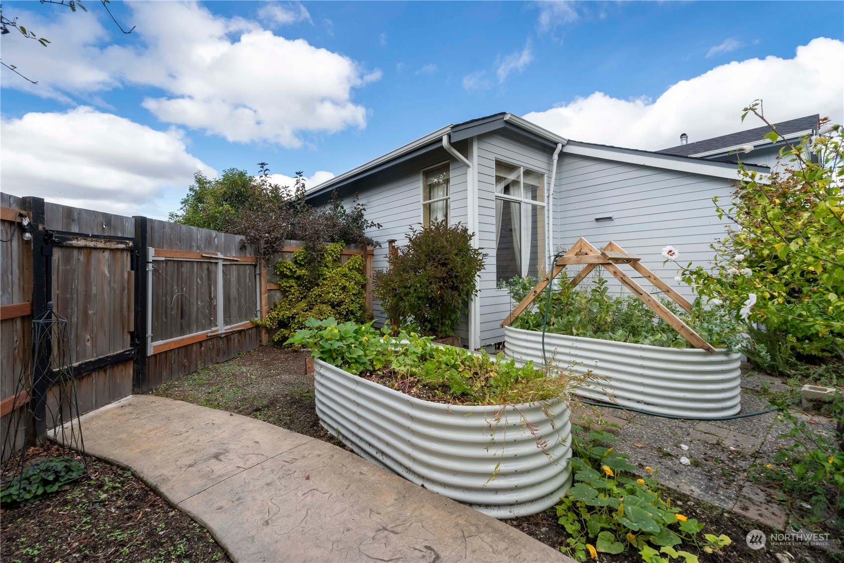 3534 Crystal Ridge Drive Southeast Puyallup, WA 98372 - Photo 35 of 39 a house view with a garden space