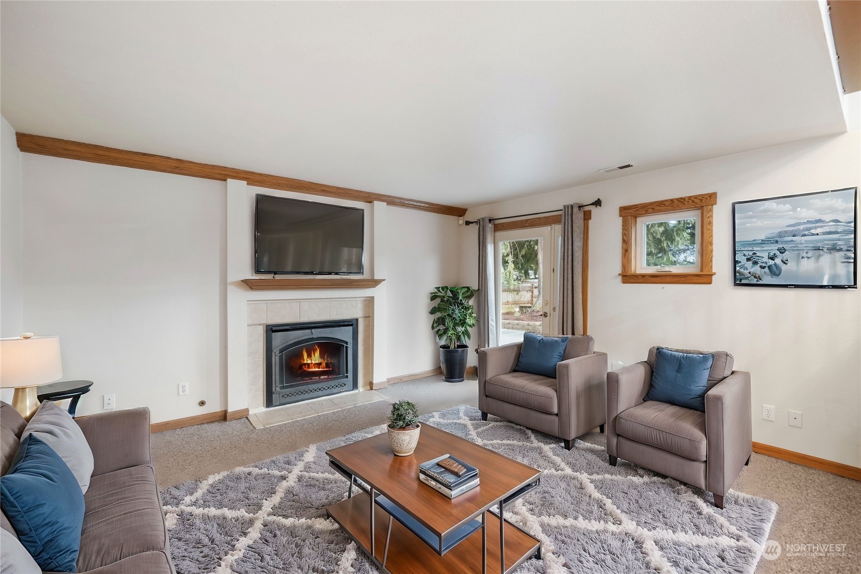 3534 Crystal Ridge Drive Southeast Puyallup, WA 98372 - Photo 36 of 39 a living room with furniture and a fireplace