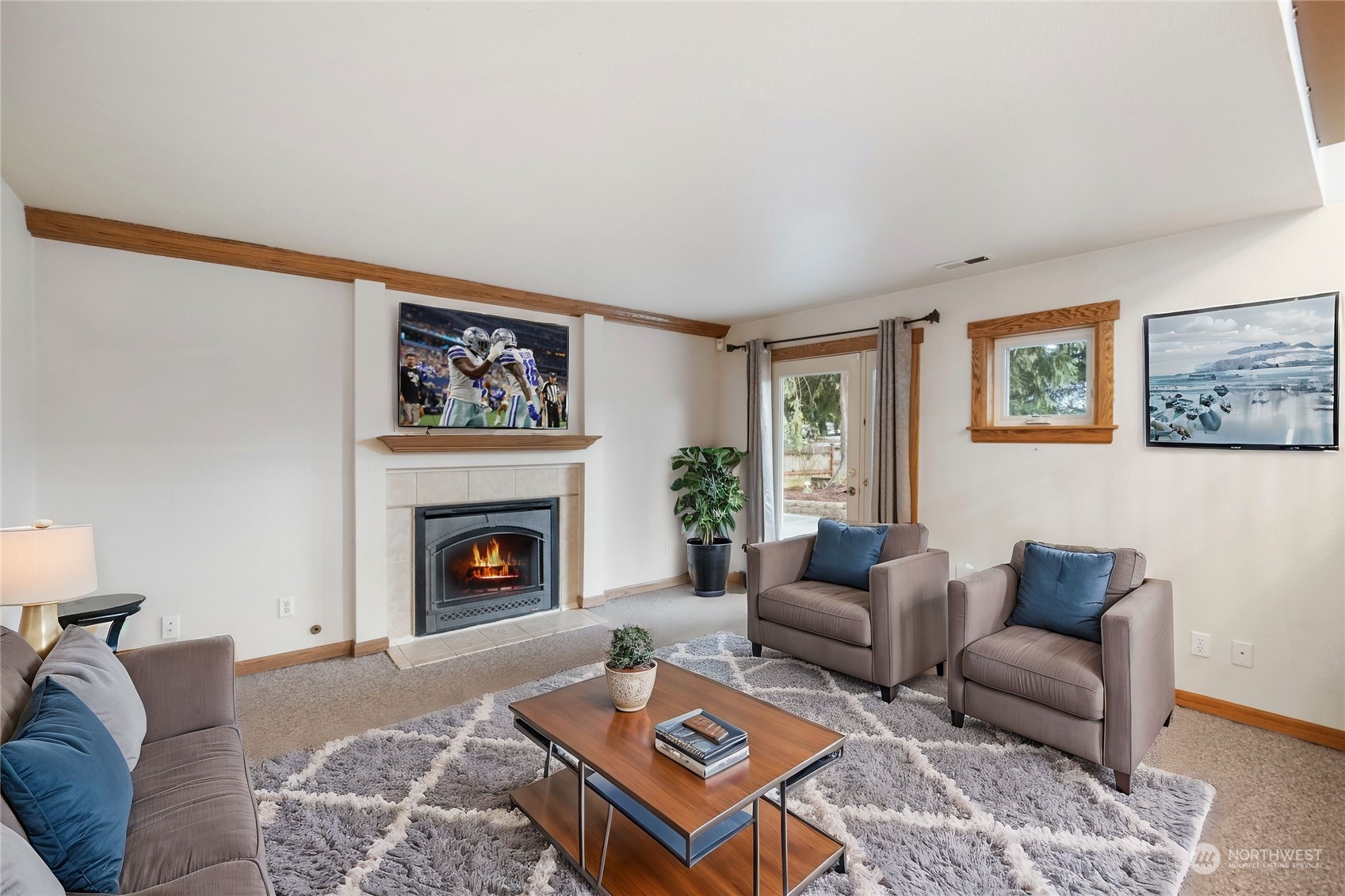 3534 Crystal Ridge Drive Southeast Puyallup, WA 98372 - Photo 8 of 39 a living room with furniture and a fireplace