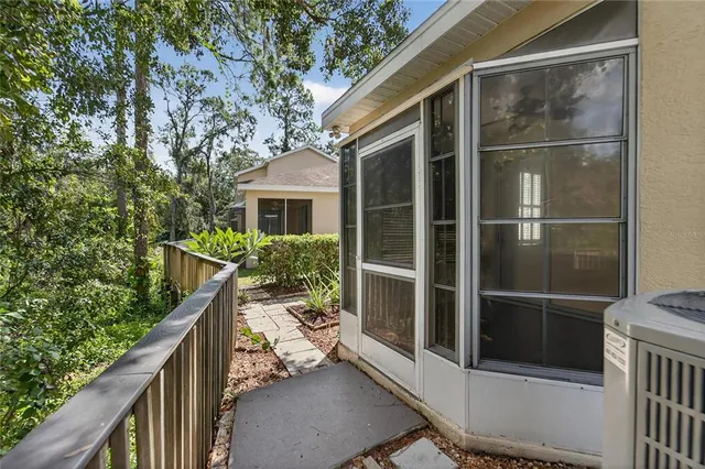 a view of house with backyard