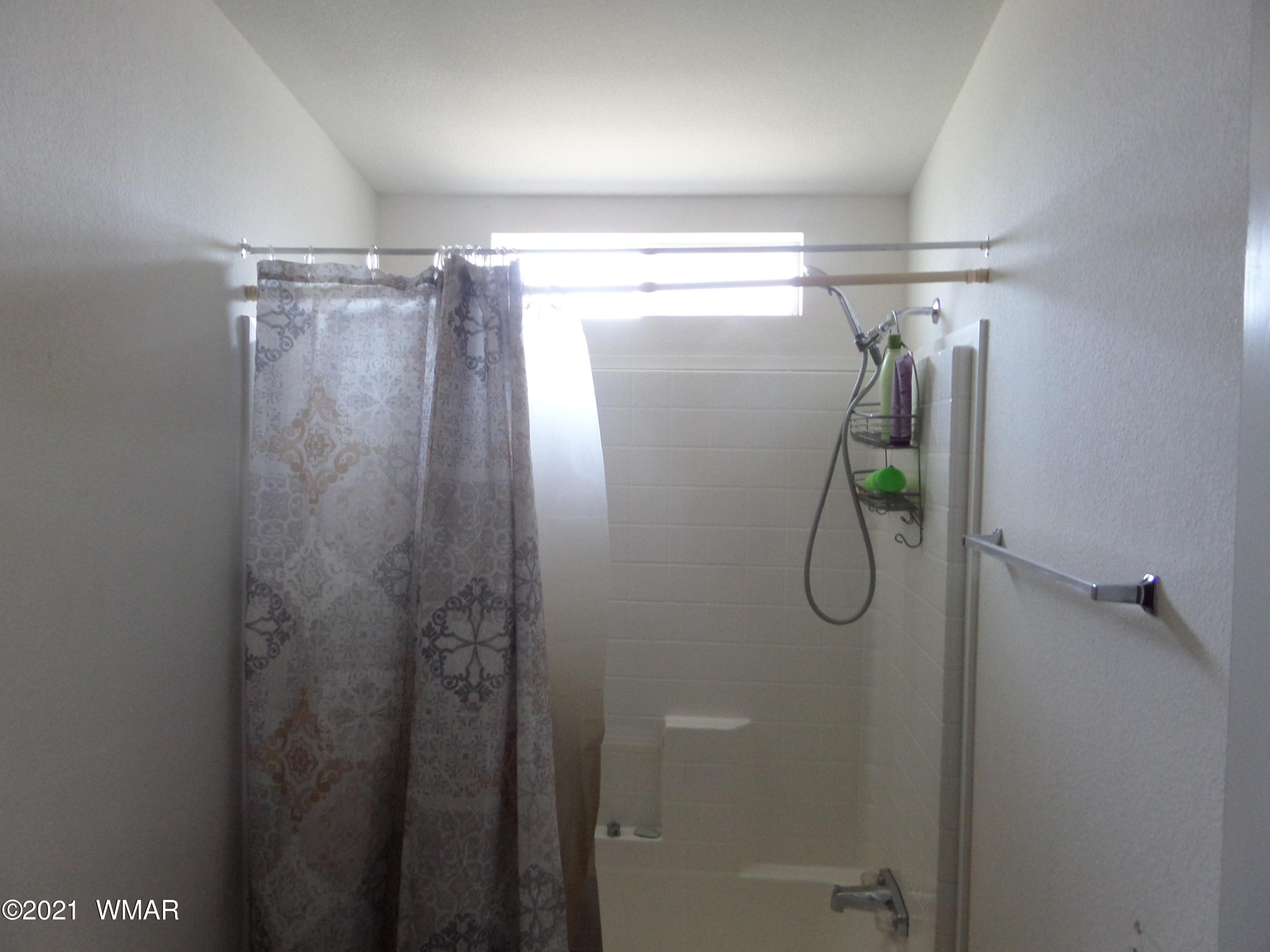 5 County Road Show Low, AZ 85901 - Photo 18 of 23 a bathroom with a glass shower door and mirror