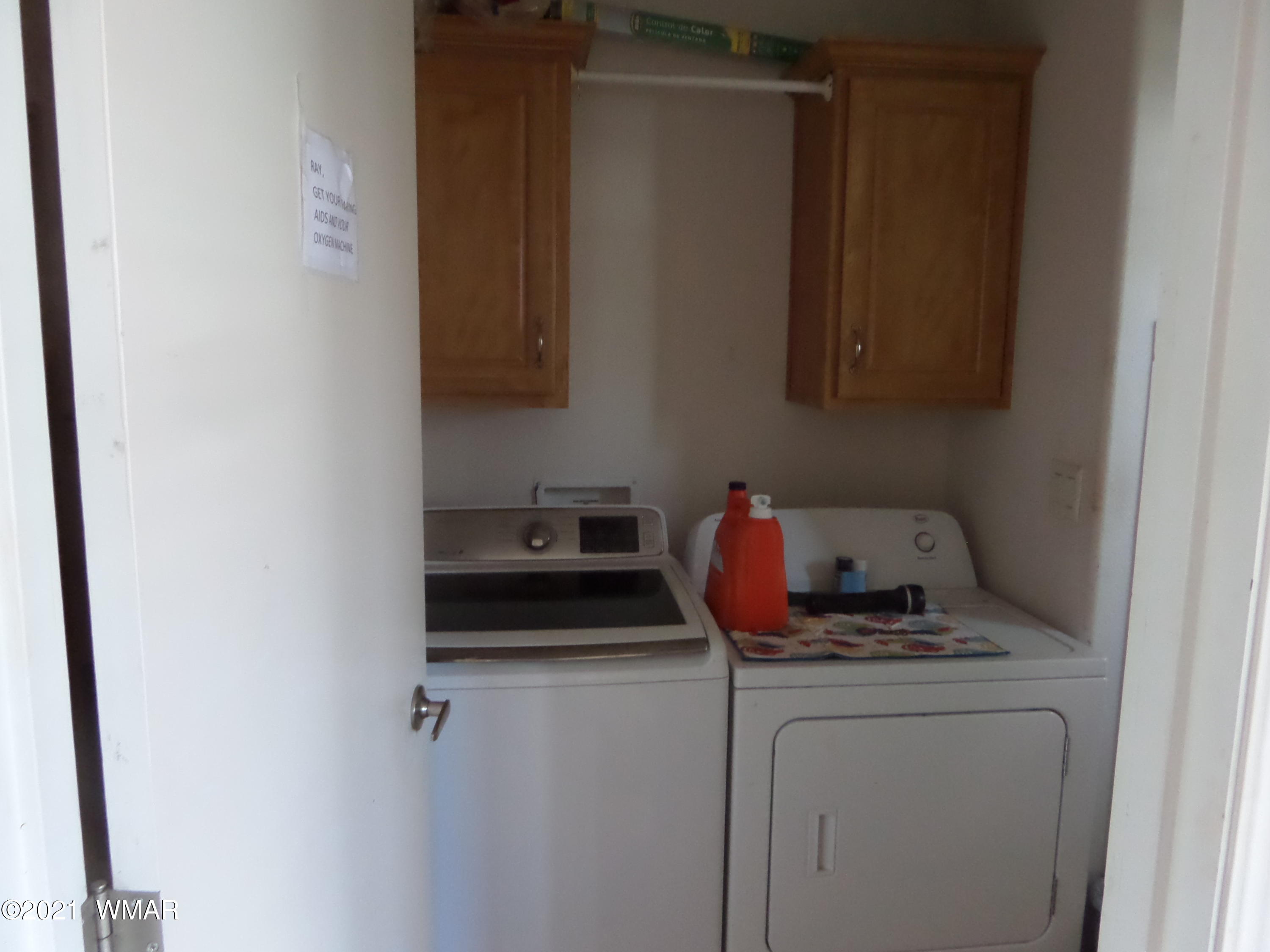 5 County Road Show Low, AZ 85901 - Photo 19 of 23 a view of a storage and utility room with washer and dryer