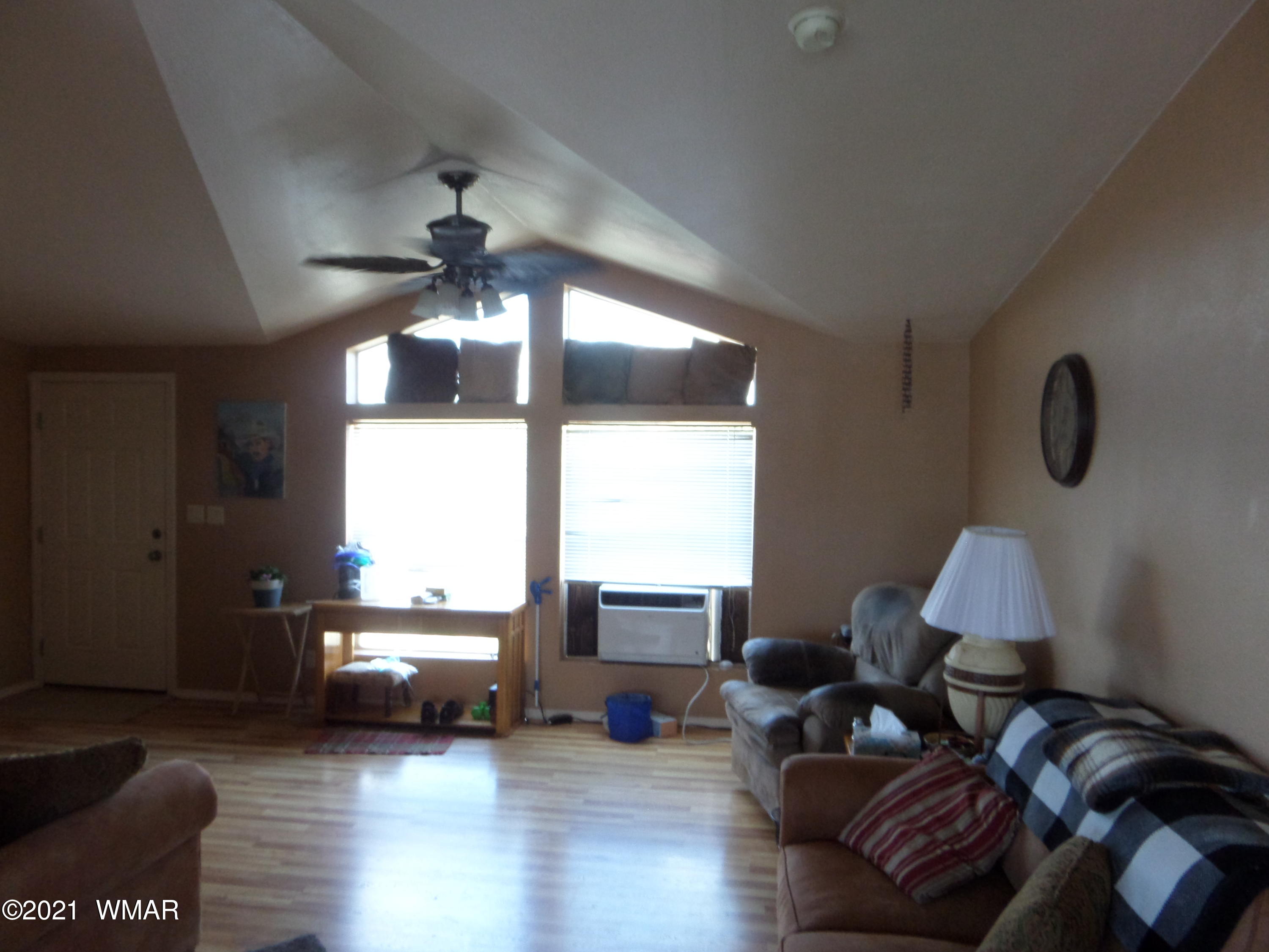 5 County Road Show Low, AZ 85901 - Photo 9 of 23 a living room with furniture a window and a chandelier