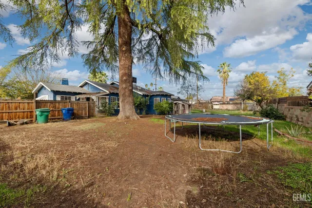 a view of a house with a backyard porch and sitting area