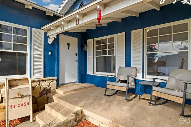 a balcony with furniture and a window
