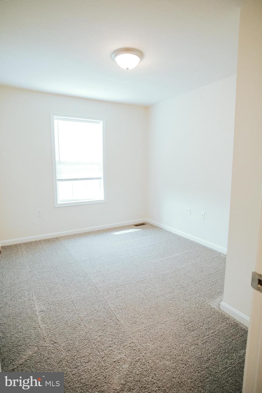 31 Deatrick Drive Gettysburg, PA 17325 - Photo 8 of 11 an empty room with a window