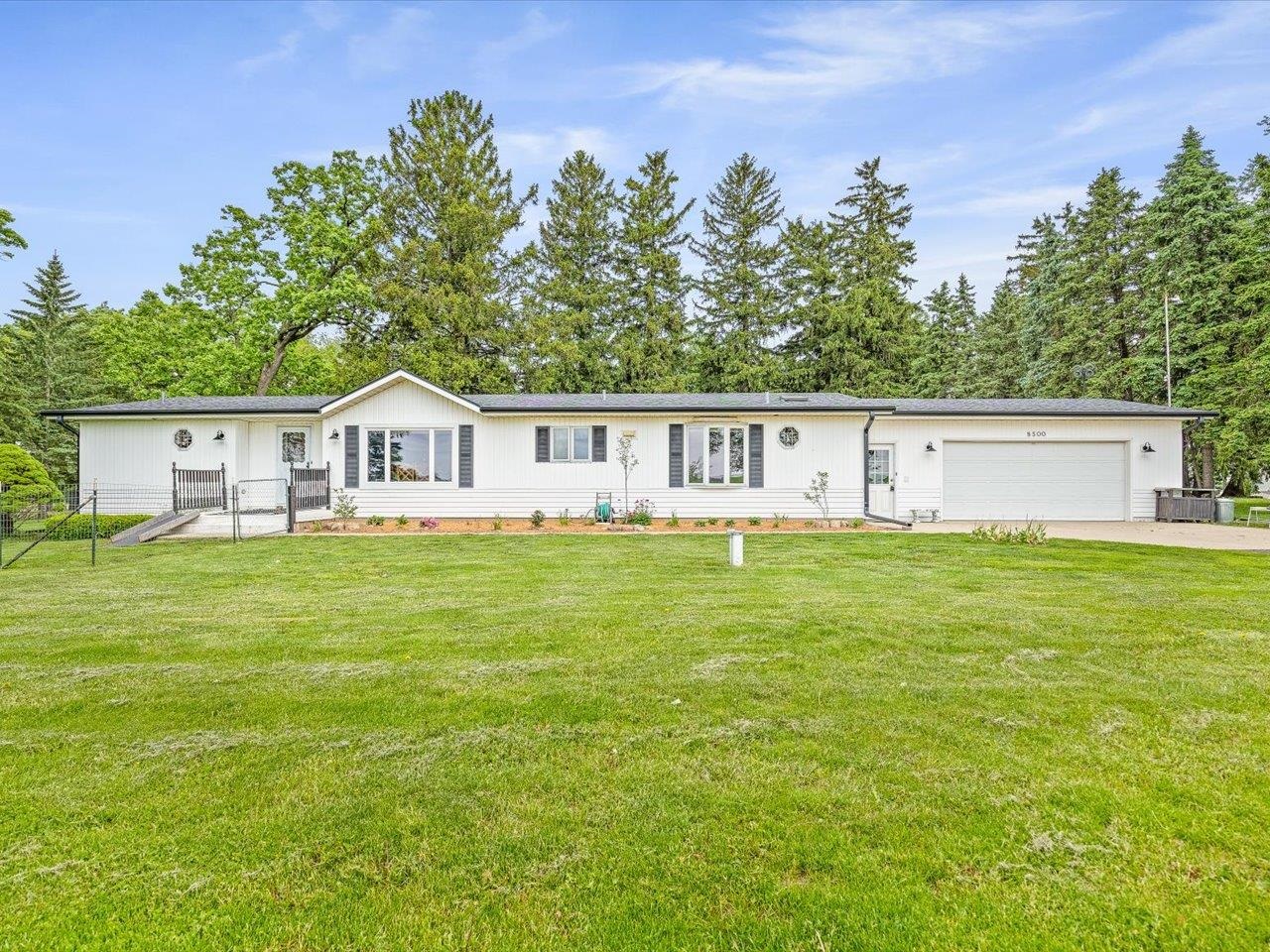 8500 Manchester Road Capron, IL 61012 - Photo 2 of 51 a view of house with garden space and trees in the background
