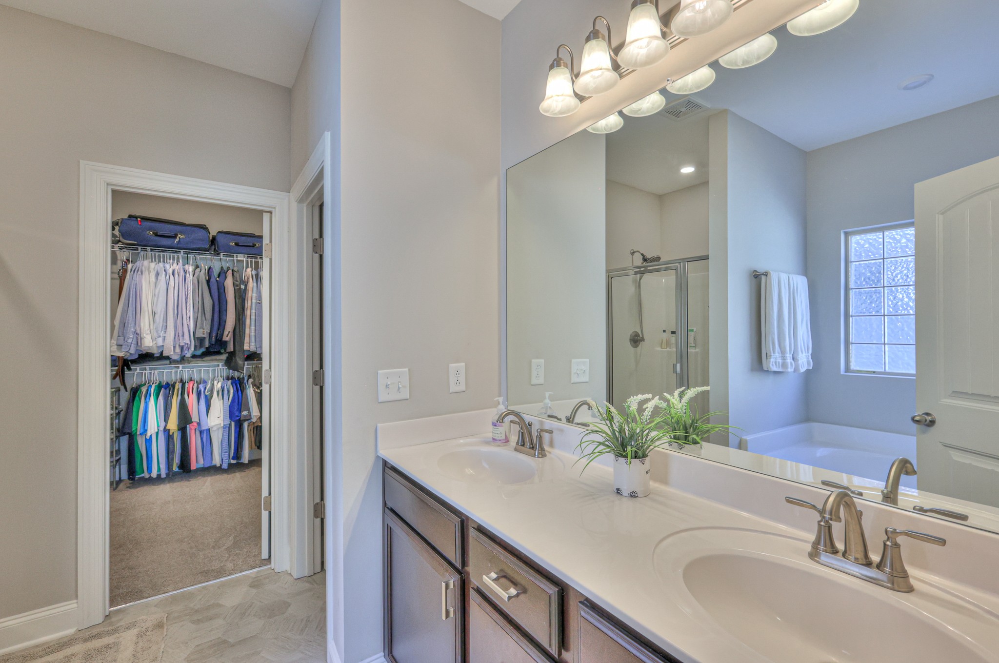 1011 Licinius Lane Murfreesboro, TN 37128 - Photo 17 of 31 a bathroom with a sink a vanity a mirror and a shower