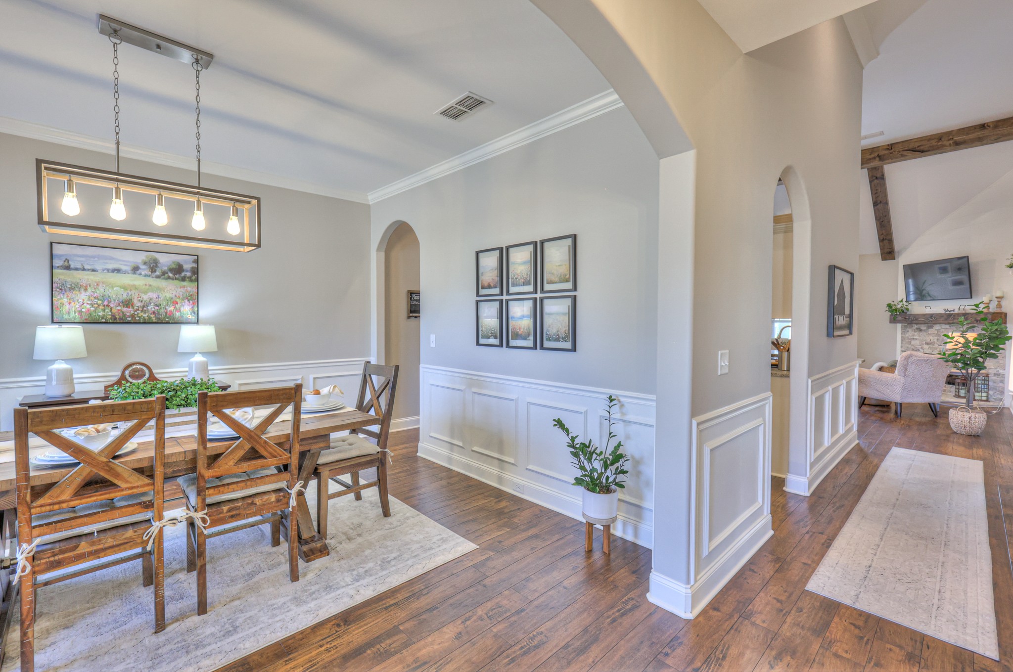 1011 Licinius Lane Murfreesboro, TN 37128 - Photo 4 of 31 a view of a dining room with furniture a chandelier and wooden floor