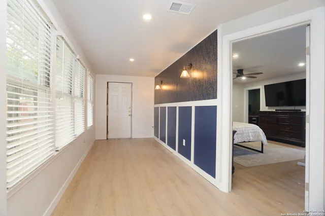 a room with furniture and a flat screen tv