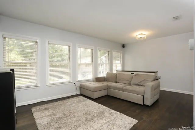 a living room with furniture and a rug