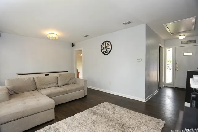 a kitchen with stainless steel appliances a stove a sink and a refrigerator