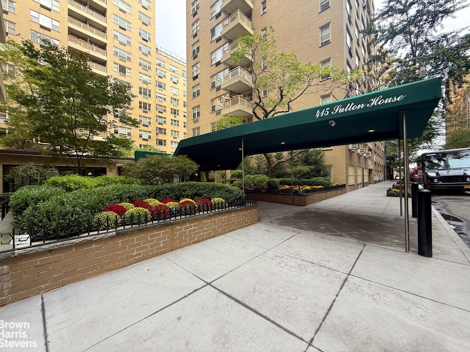 415 East 52nd Street, Unit 3EC Manhattan, NY 10022 - Photo 10 of 12 a view of street with couple of cars parked on road