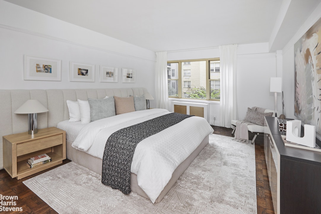 415 East 52nd Street, Unit 3EC Manhattan, NY 10022 - Photo 7 of 12 a bedroom with a bed and a tv