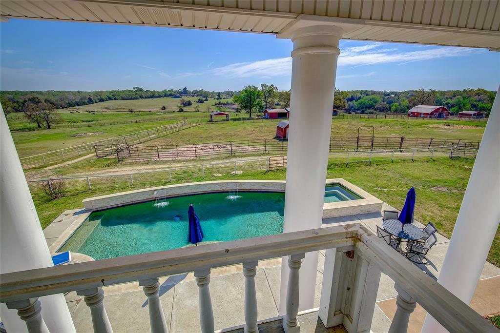 7359 Highway 154 Sulphur Springs, TX 75482 - Photo 26 of 40 view of pool and property from upstairs primary balcony