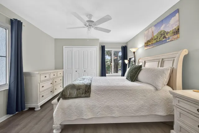 a bedroom with bed and a chandelier