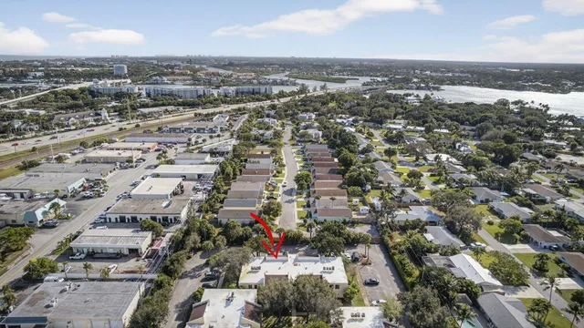 a front view of house with yard space and balcony