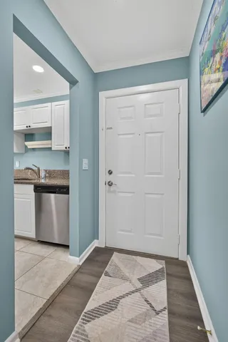 a kitchen with granite countertop a stove and cabinets