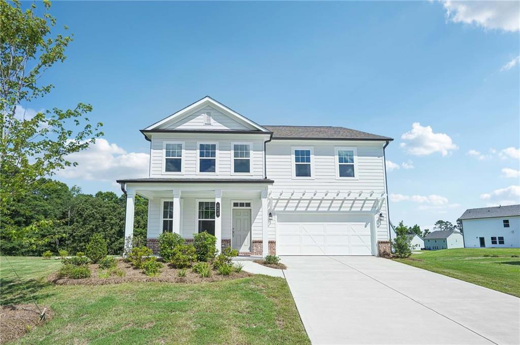 front view of a house with a yard
