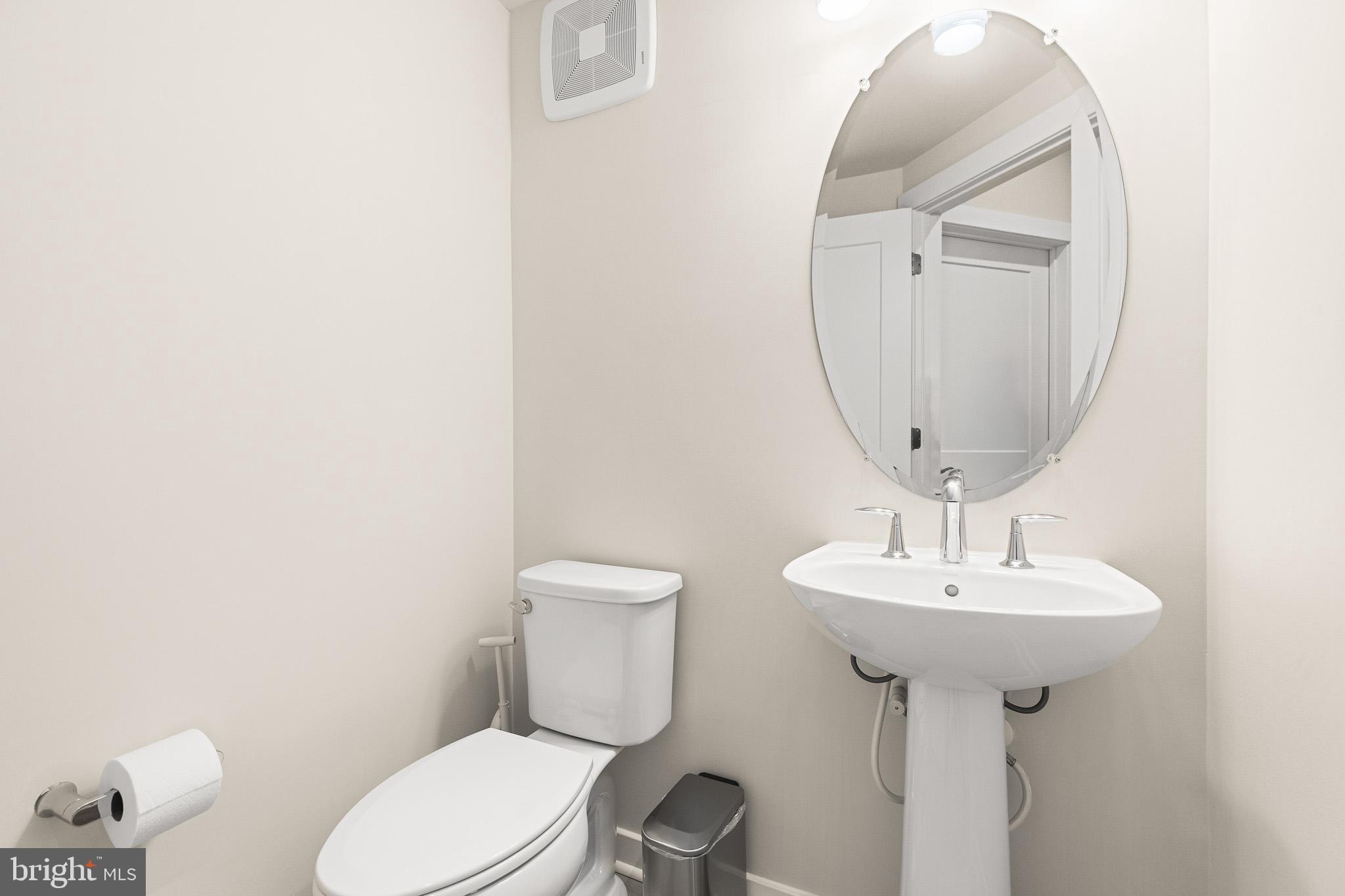 43769 Transit Square Ashburn, VA 20147 - Photo 13 of 36 a bathroom with a sink toilet and mirror