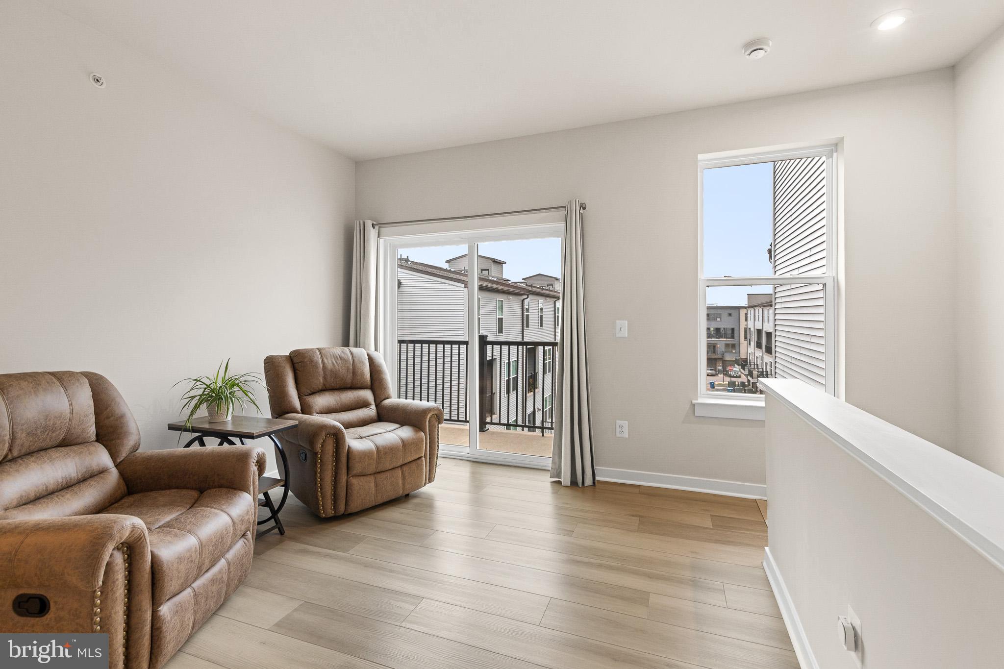 43769 Transit Square Ashburn, VA 20147 - Photo 14 of 36 a living room with furniture and a window