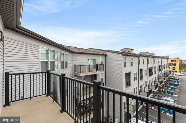a view of a house with wooden fence