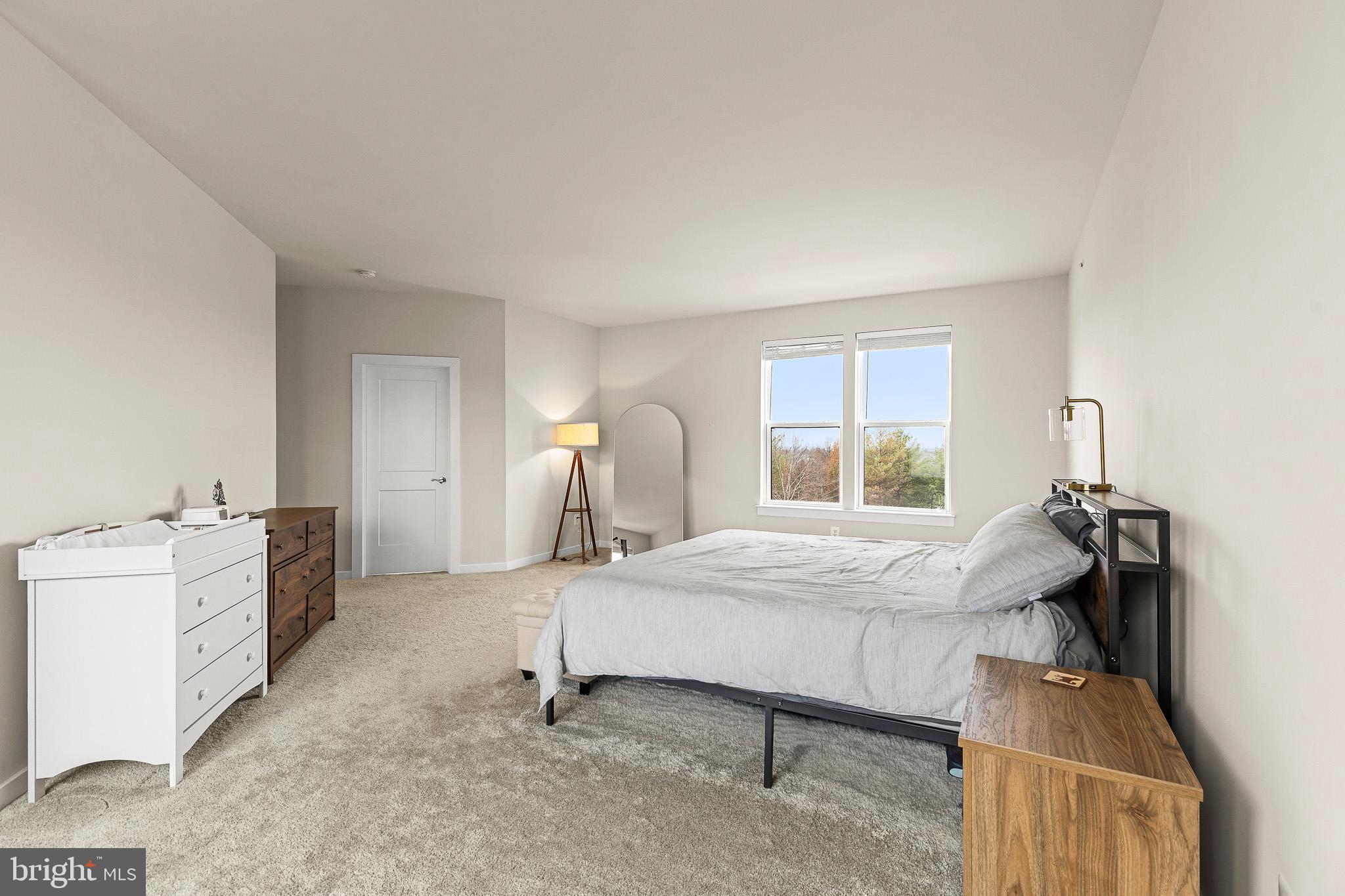 43769 Transit Square Ashburn, VA 20147 - Photo 21 of 36 a bed room with furniture and a window