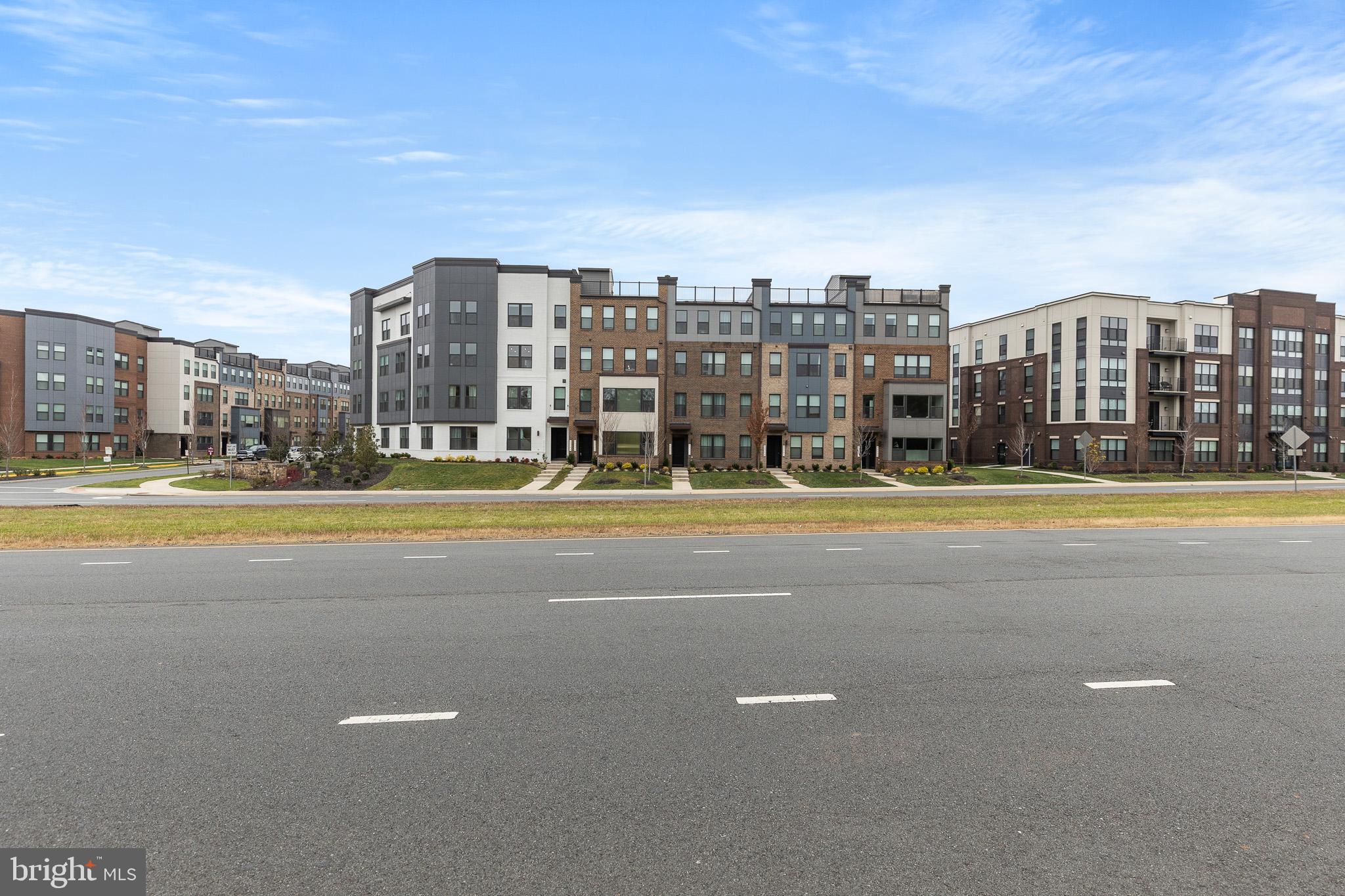 43769 Transit Square Ashburn, VA 20147 - Photo 29 of 36 a view of building with a big yard and large trees